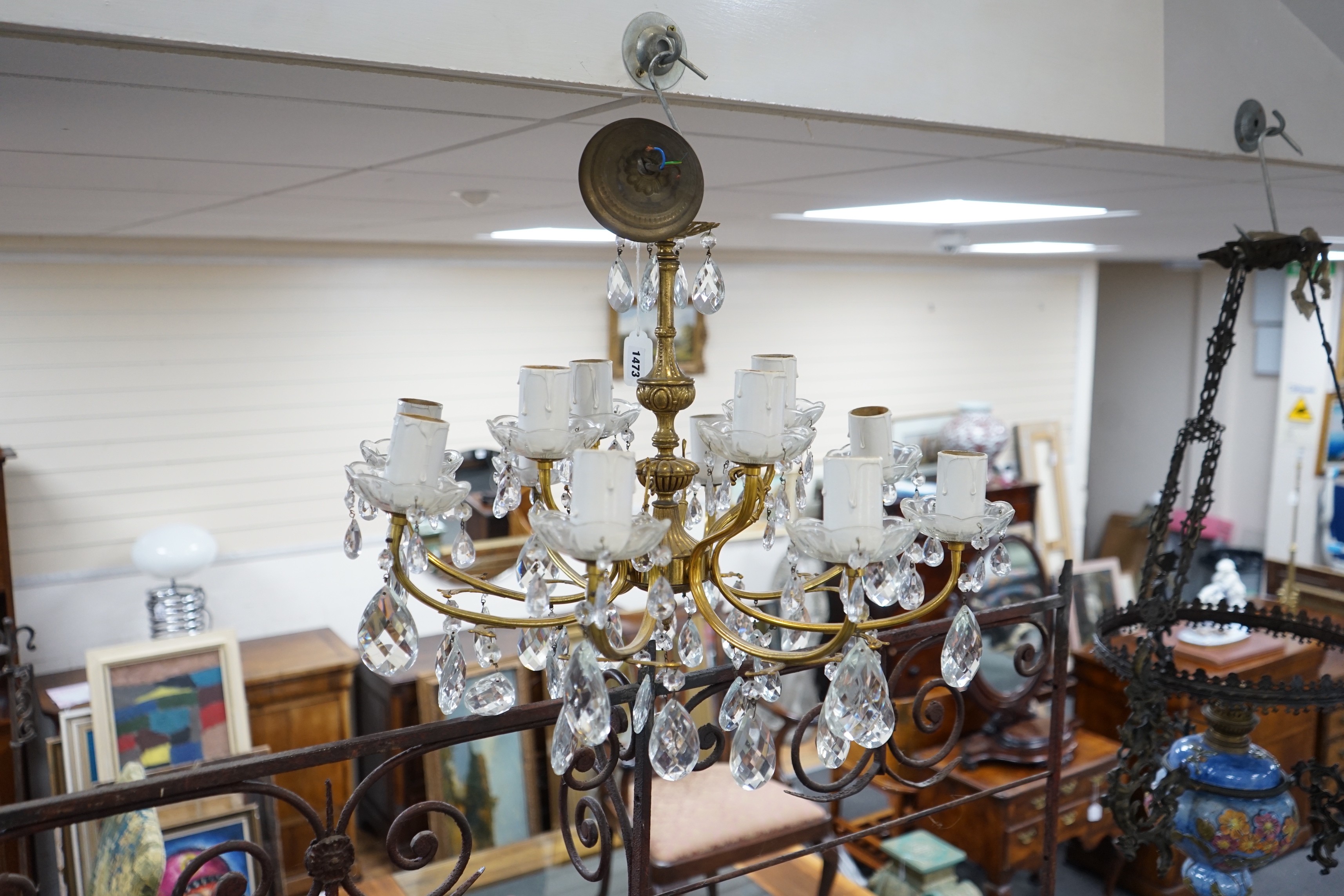 A cut glass eight branch twelve light chandelier, 39cms high